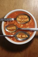 Bowl of soup that spells out, "Soop Spoons, Thurs, the Mill".