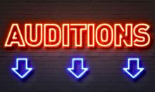Neon lettering "Auditions" over 3 arrows pointing downward