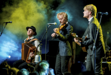 Members of the group on stage during a performance