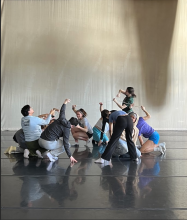 students in Introduction to Dance Class pose on stage