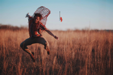 Person jumping in field