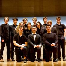 Musicians posing on stage