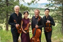 Members of the Quartet standing outside, holding their instruments