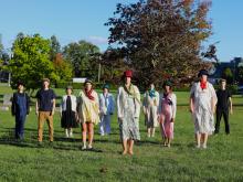 People standing in a group on a lawn