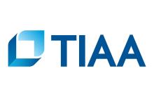 Blue text that says TIAA and a blue 3-d square that is the logo for TIAA.