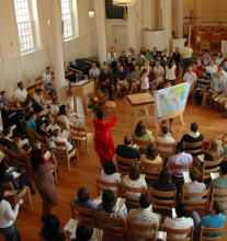 People seated in room for religious event