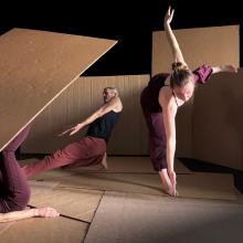 2 dancers dancing with cardboard