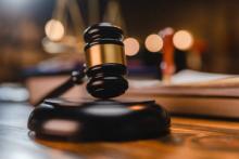1 Gavel on wooden table.