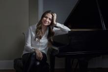 artist sitting at a piano