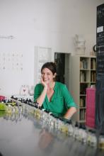 Saskia Wilson Brown sitting at a counter