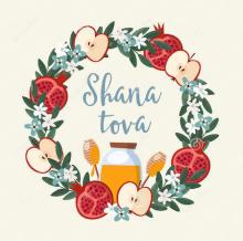 colorful graphic of wreath with apples, pomegranates and honey