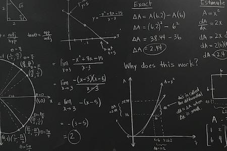 Image of calculus equations on a chalkboard