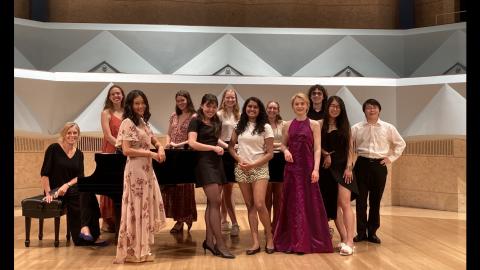 photo of the performers on stage with the accompanist