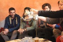 Photograph of 4 people sitting and drinking tea