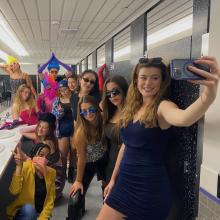 Members of the cast in costume taking a selfie