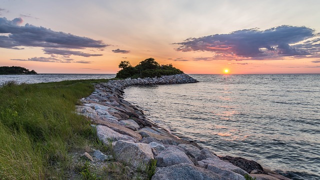Cape Cod coastline, showing rocky levy at sunset