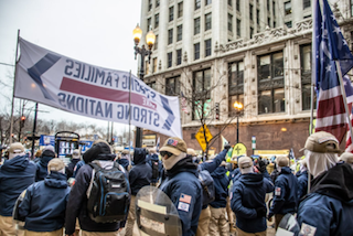 Militia members seen in a rally in a city