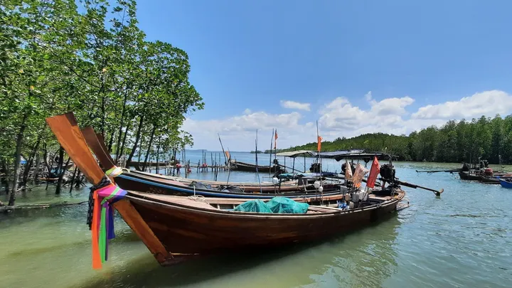 long wooden boat colorfully painted