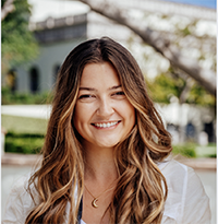 Melissa Ashley, a young woman with a huge, bright smile, smiling eyes, and long beautiful hair