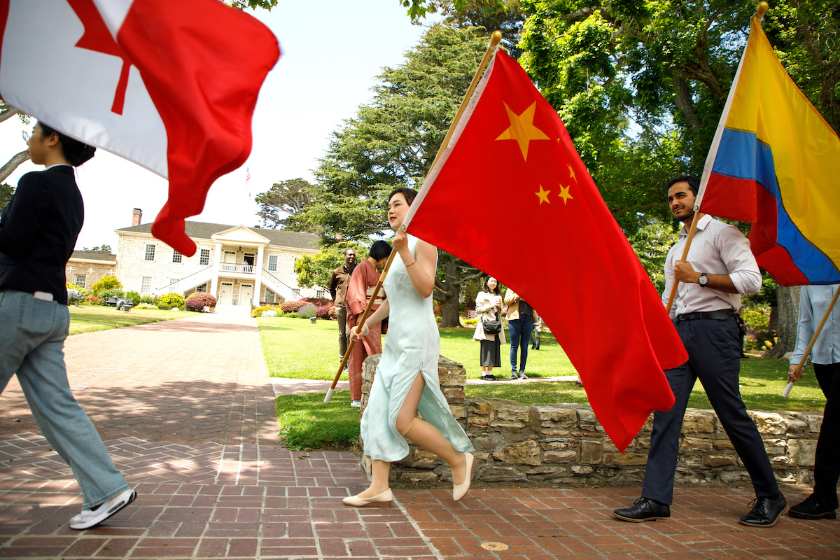 Student carries Chinese flag in the procession