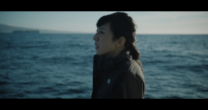 Director and LA Times Report Rosanna Xia shown in profile against the sea