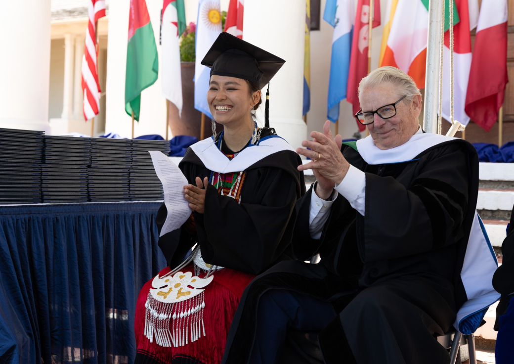 Commencement speakers, Julena Wuer and Senator Bill Monning, applauding