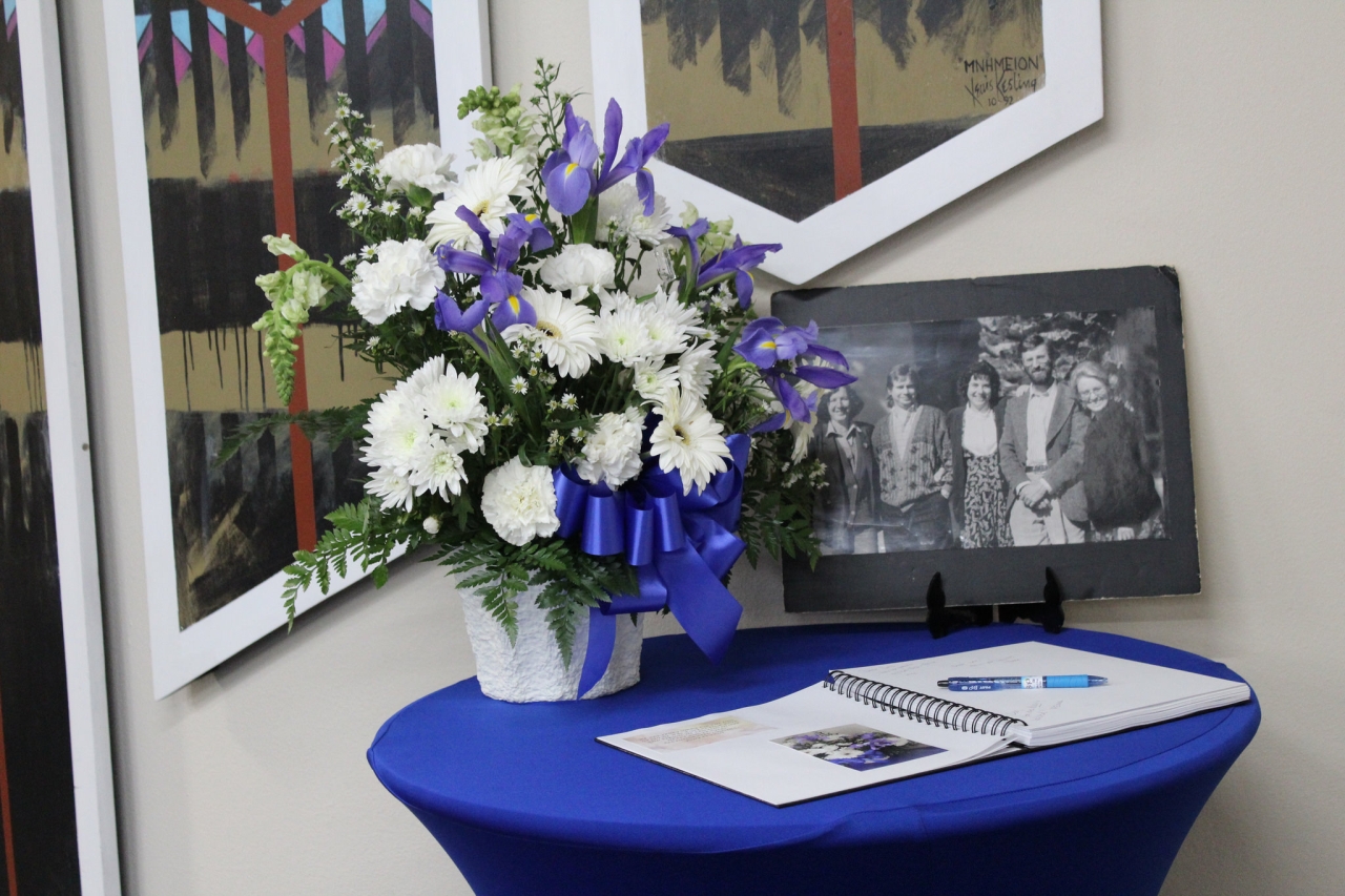 Sign-in table with picture of Leo van Lier and other TESOL faculty