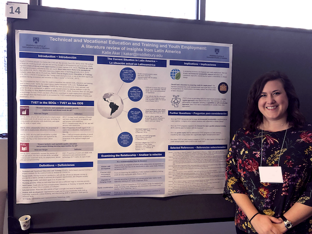 Katie Aker standing in front of her poster