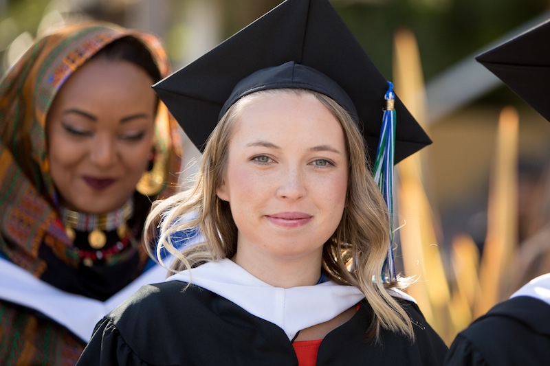Happy student stopping during processional