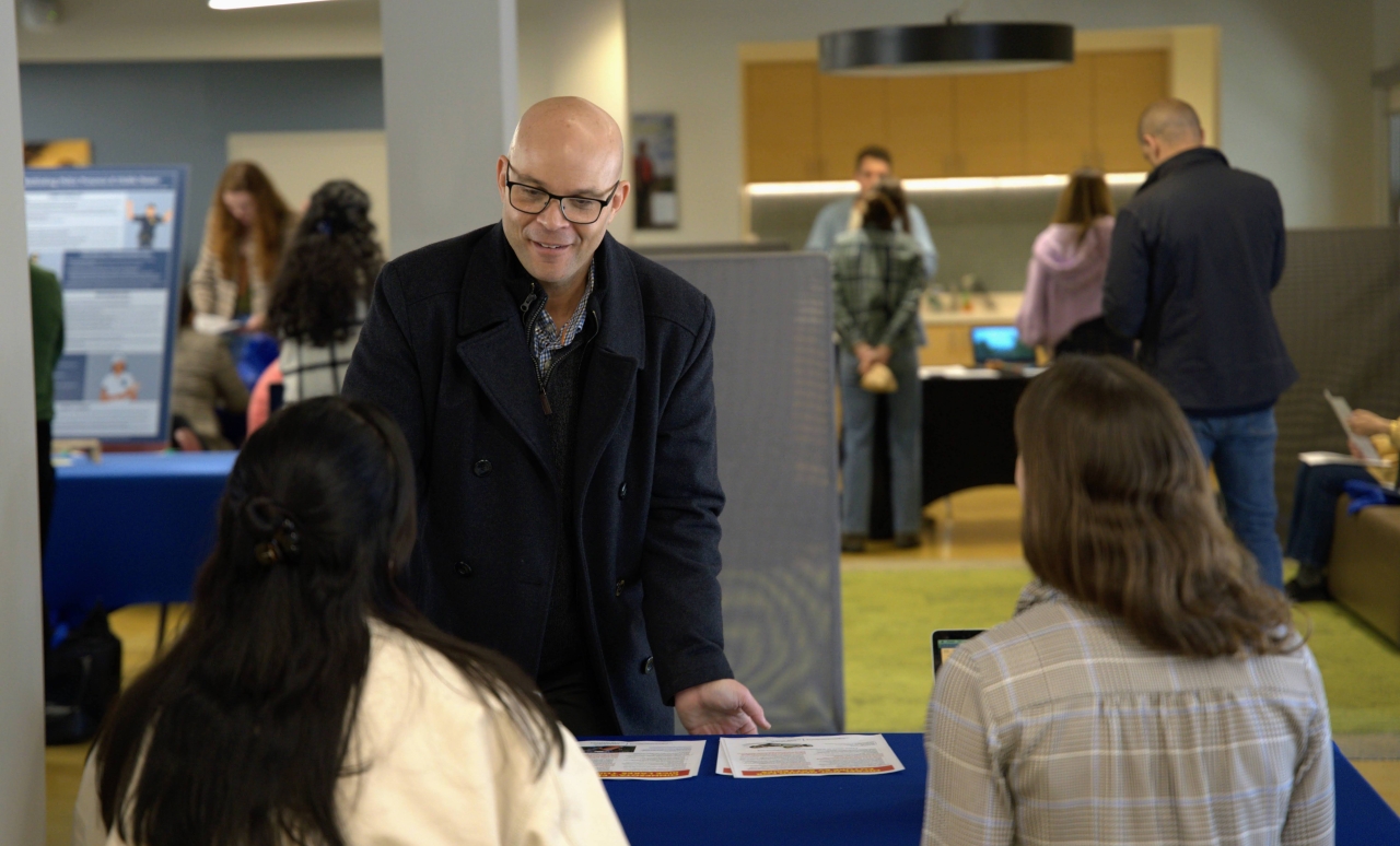 Amy War College Fellow LTC Ken McGraw hears from Conflict Transformation Fellows in the International Environmental Policy Program