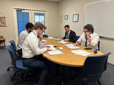A group of students around a table