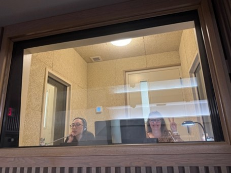 Two students in an interpretation booth