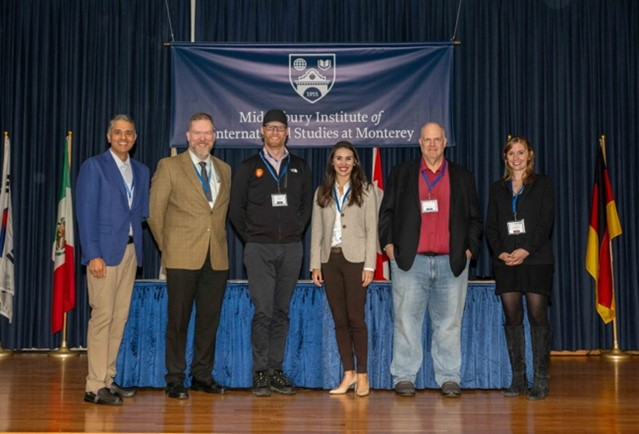 A group of six people on stage