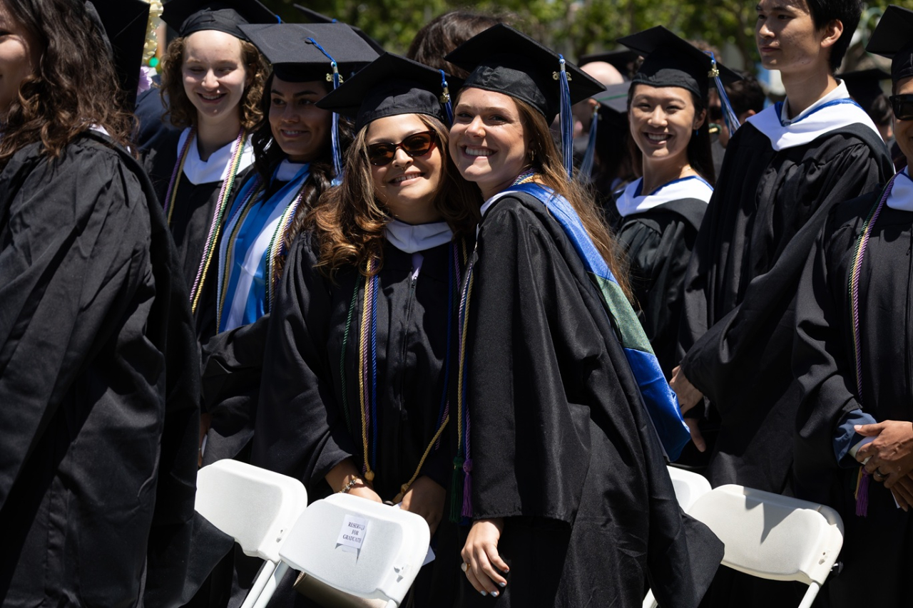 Students smiling Spring 2026 Commencement