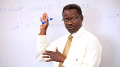 Professor Coly teaches a policy class in French.