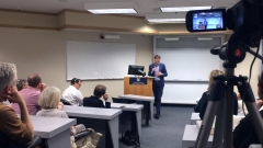 Consul General of France speaking to audience