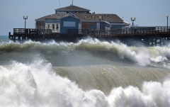 Big Wave coming up over condemed house