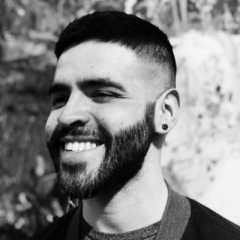 Black and white headshot of Gustavo Mercado