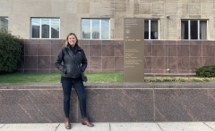 Woman (Blaine Barkley) standing in front of a building