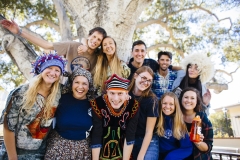 Returned Peace Corps Volunteers wearing clothes representative of countries they served in