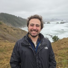 Alex Shahbazi looking so happy in an Arctic valley green and lush with life