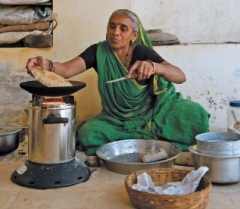 Woman using a clean cook stove