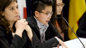 Students participate in a trade negotiation simulation.
