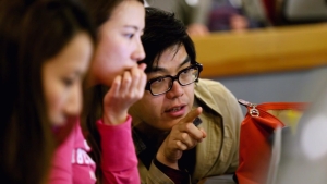 Students work together on a TLM project at the computer.