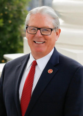 Senator Bill Monning headshot in a suit wearing glasses