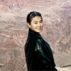 Profile image of Julena Wuer in black jacket with a canyon background