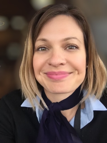 headshot, short hair, dark purple scarf, smiling