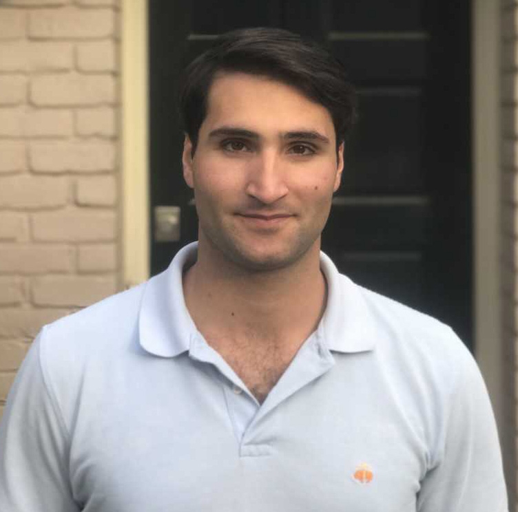 Carlos-Henri Ferré, M.A. Candidate 2018, International Environmental Policy, dark haired young man standing in front of doorway