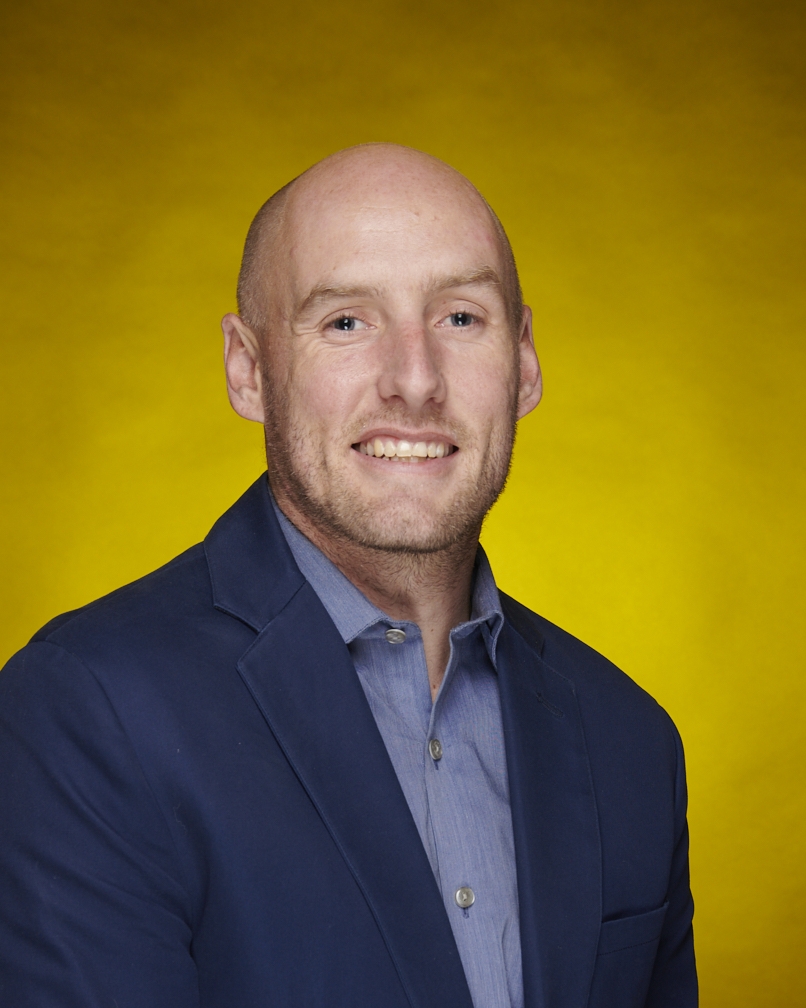 Bald Caucasian male in a suit--head-shot of Steve Campbell, Policy Manager, GRID Alternatives