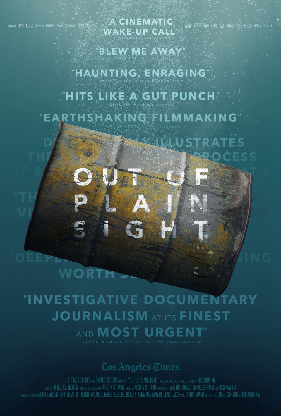 Underwater scene of a metal barrel, rusted and ominously leaking, with praise for the film in the background